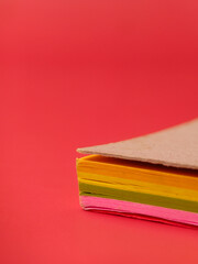 Fototapeta premium Closeup of a neon-colored sticky notes, often used for reminders and organization