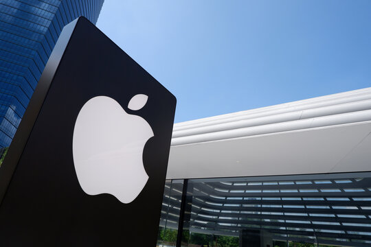 Kuala Lumpur, Malaysia on 18 August 2024: Close up of Apple store logo is shown in front of the newest Apple store at TRX Exchange shopping mall, KL. Apple signboard with a futuristic building behind