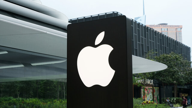 Kuala Lumpur, Malaysia on 18 August 2024: Close up of Apple store logo is shown in front of the newest Apple store at TRX Exchange shopping mall, KL. Apple signboard with a futuristic building behind