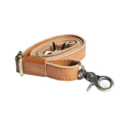 Light brown leather strap rolled up and isolated on white background, perfect for leather industry catalog design