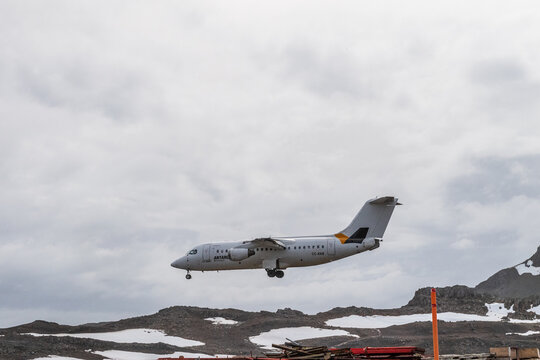 King George Island, Antarctica - February 3, 2024. A british Bae 146, also known as the AVRO RJ, operated by Antarctic airways, or DAP airlines, approaches King George island, to pick up Antarctic