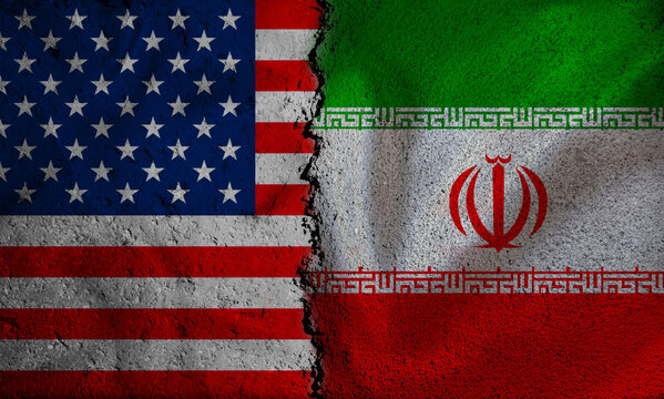 Iranian and American flags on a broken wall. USA and Iran Conflict Concept with Cracked Flags Background
