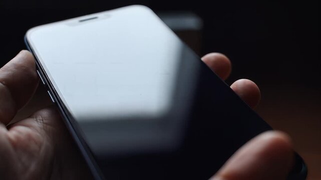 Close-up cinematic shot of a modern smartphone held in a hand, screen reflecting subtle light, symbolizing connectivity, communication