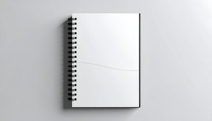Spiral bound notebook, blank white pages, centered on a white surface