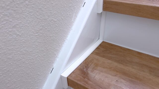 Close up of stair tread and wall seam