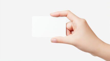 Obraz premium Close-up of a hand holding a blank transparent business card against a light gray background, isolated studio shot with soft lighting and clear copy space for branding.