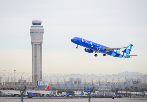 Las Vegas, USA &ndash; Dec 23 2025: JetBlue Airways aircraft N982JB Airbus A321-231 taking off. Air Traffic Control Tower in the background. Harry Reid International Airport.