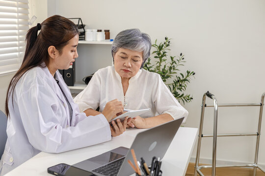 Senior, doctor, healthcare, elderly, medical patient consultation at clinic with laptop and tablet diagnosis talk, symptom assessment, chart review, monitoring results, follow up, Senior healthcare