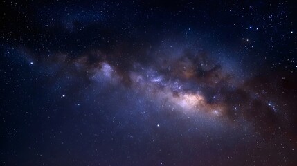 Fototapeta premium A breathtaking panoramic view of the Milky Way galaxy stretching across a dark star filled night sky with vibrant cosmic colors