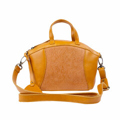 Beautiful turmeric yellow leather bag for women with floral embossed decoration, isolated on white background. Perfect for leather product catalog design.