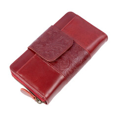 Beautiful red leather wallet for women, with floral embossed pattern isolated on white background. Perfect for leather product catalog design.
