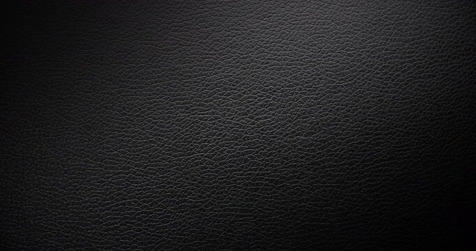 Surface of black leather, slowly rotating. Use for background and texture.	A high-resolution dark leather texture background captured in smooth, rotational motion. Use for background and texture.