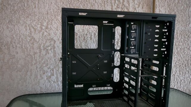  Old dissolved computer tower placed on a glass table outdoor. Random camera movement.