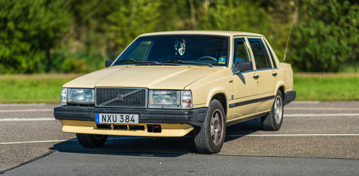 Gothenburg, Sweden - september 07 2025: Old beige Volvo classic sedan on asphalt road.
