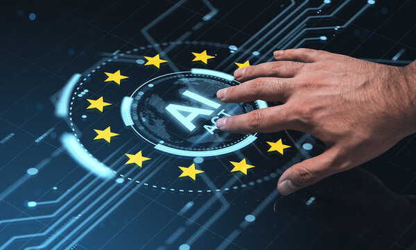 Human hand interacting with futuristic holographic AI Act interface surrounded by EU stars on a digital screen background in a tech concept scene.