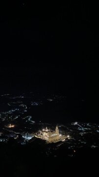 Night panorama of Ja&eacute;n Cathedral illuminated above the city from the Parador, Andaluc&iacute;a, Spain