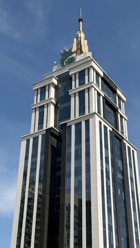 Modern skyscraper at dusk in UB City, Bengaluru. 