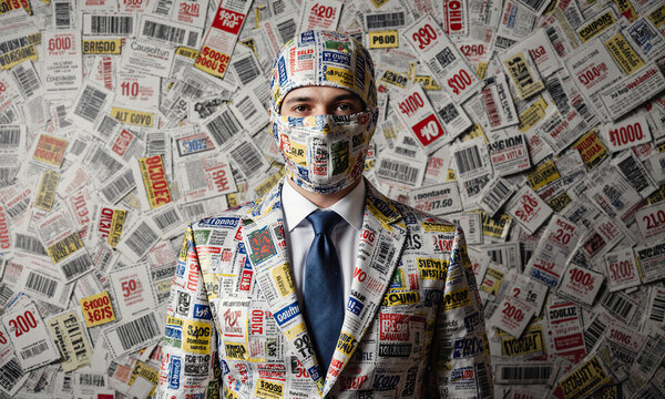 Coupon camouflage bargain hunter wearing a suit made of vouchers blends into a matching wall representing consumerism