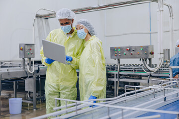 Food hygiene inspector team work examination food production process in line at cannery food factory