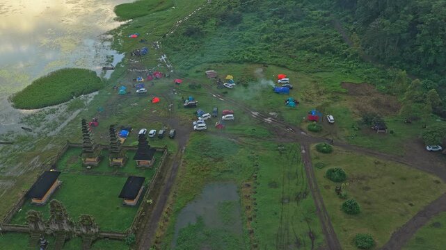 Aerial view of tamblingan lake bali with temple and campsite
