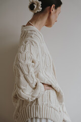 Minimal Lifestyle Fashion With Woman In Beige Knit Cardigan On Simple Background