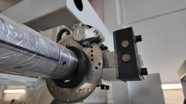 Industrial machine brake caliper engaging disc