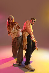 Couple of hip-hop dancers on grey background