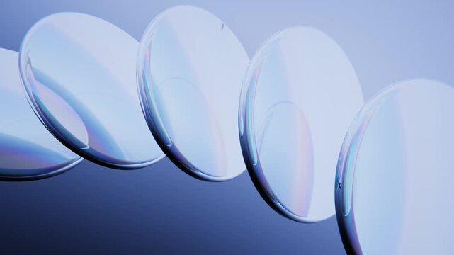 Glass lenses reflecting iridescent light and dispersion background. Endless loop.