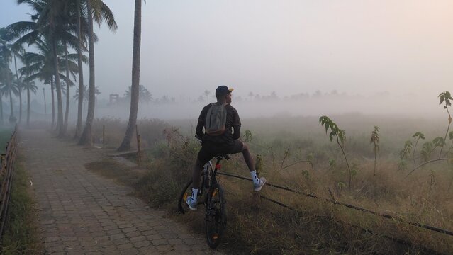silhouette of a man on a bicycle
