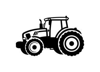 Fototapeta premium Modern tractor driving through field with large wheels