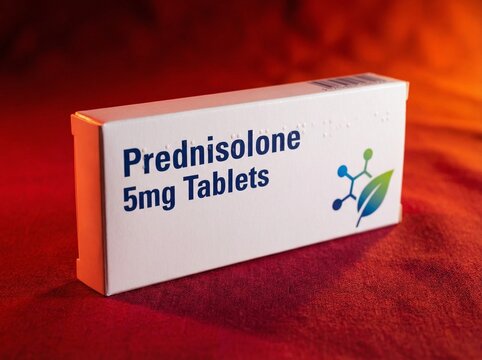 Medicine box of Prednisolone. White box with some small graphic design, red background. Vivid light,  professional photo.