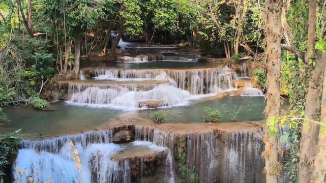 flowing water stream creek cascade waterfall in tropical forest