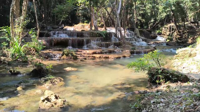 flowing water stream creek cascade waterfall in tropical forest