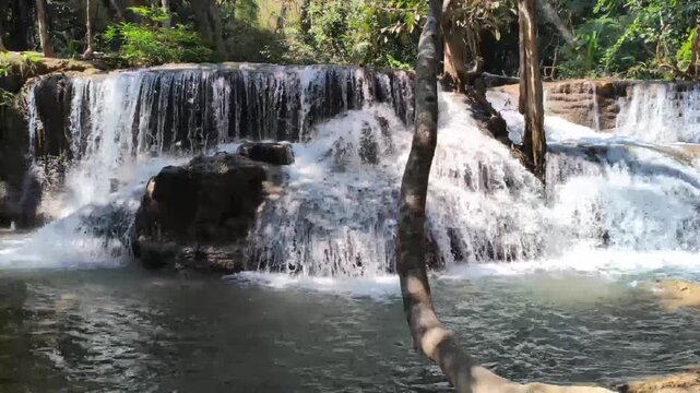 flowing water stream creek cascade waterfall in tropical forest