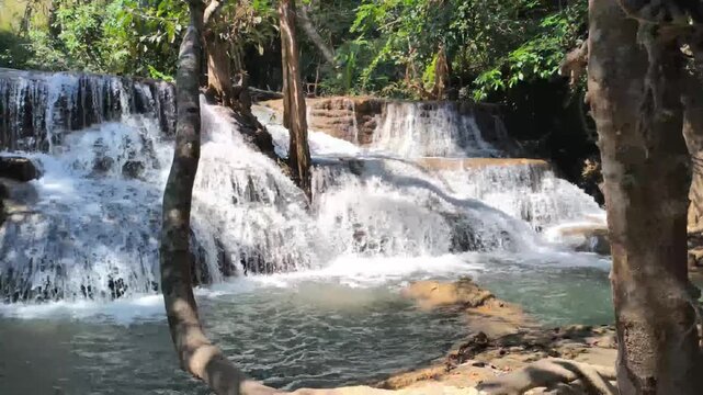 flowing water stream creek cascade waterfall in tropical forest