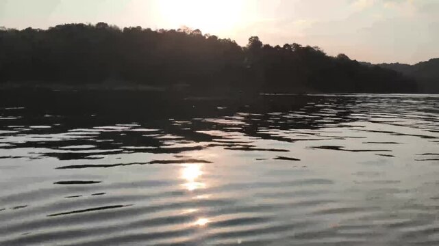 sun light sunlight on water ripple in river at dawn