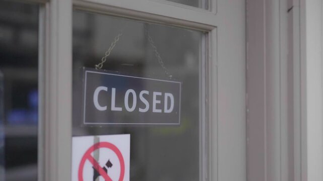 UK shop window, closed sign displayed. 