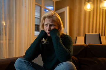 Obraz premium Young attractive blonde woman sitting at home living room couch feeling sad tired and worried suffering depression in mental health, problems and broken heart concept
