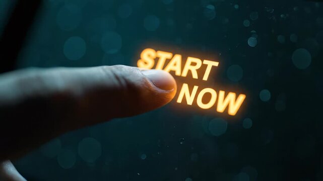 Close-up of a businessman's finger pressing a glowing 'Start Now' button on a dark digital screen, concept for motivation launch, immediate action prompt and success initiation