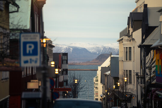 Scenic view of Laugavegur street leading to the sea with Mount Esja in winter sunset light, Reykjavik