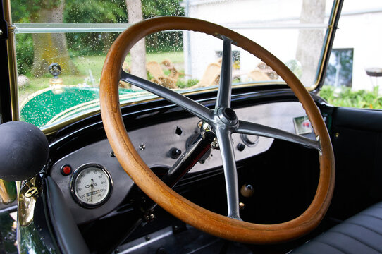 Vintage Car Interior with Rain-Splashed Windshield