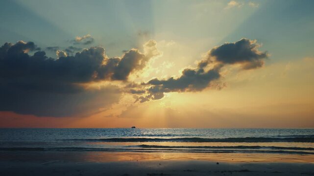 Golden sunrise breaks through storm clouds over calm ocean as a tiny fishing boat glides under god rays. Inspirational sunrise scene with god rays over sea and a peaceful morning for faith and hope.