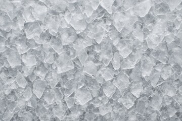 Obraz premium Close-up of crushed ice texture with sharp translucent edges forming a seamless frozen background pattern for cold freshness concept design use. Ai generative