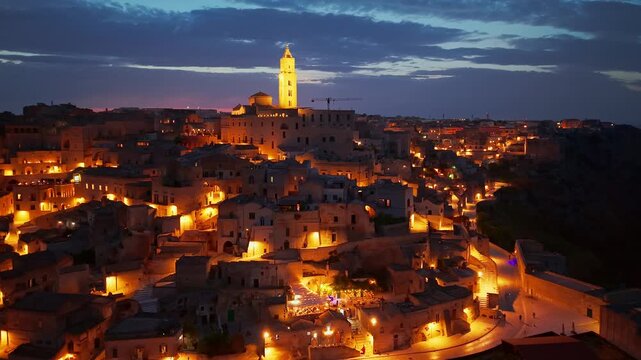 Aerial night view of the illuminated Sassi di Matera, Basilicata, Italy