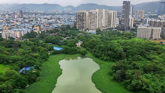 Aerial shot of Lake in the middle of downtown Mumbai, Maharashtra, in the morning