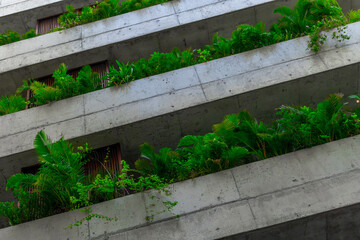 Modern urban architecture with lush green balconies