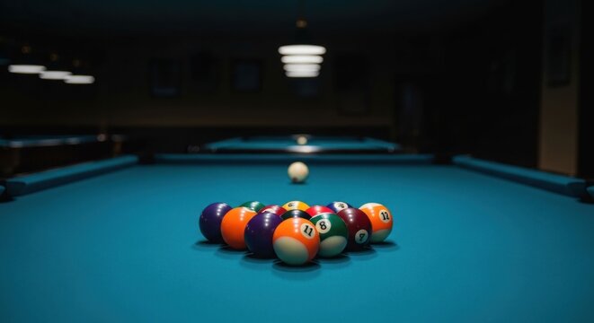 Billiard balls racked, waiting on a teal table under ambient lighting