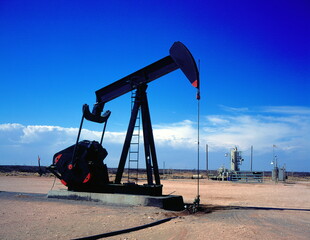 Classic oil pump jack on an oil field in Texas, USA.