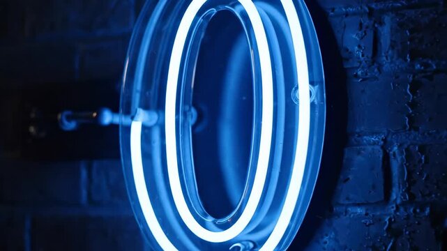 Neon Zero Sign Illuminated Against a Dark Brick Wall.