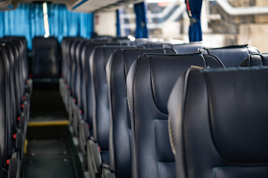 Interior of a bus with empty seats and seats in a row